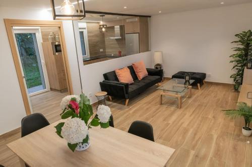 a living room with a table and a couch at Casa Tía Pepa 