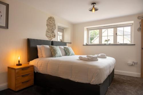 En eller flere senge i et værelse på Poppy's Barn