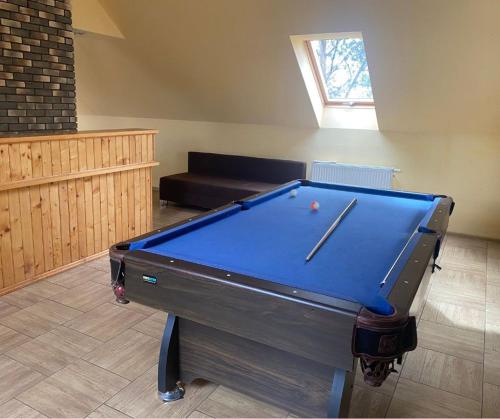 a pool table in a living room with a couch at Agroturystyka Włochate Ranczo 