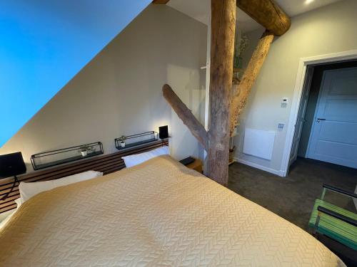 Ein Bett oder Betten in einem Zimmer der Unterkunft Klein Nienoord Midwolde