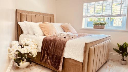 a bedroom with a bed with two towels on it at Cozy Charming Bungalow BRAND NEW in Preston