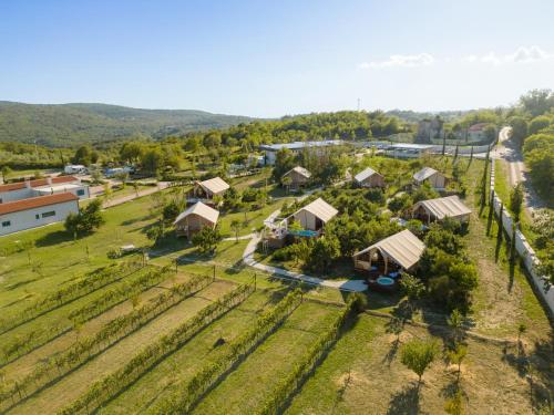 an aerial view of a small village with houses at Floria Glamping Garden in Labin