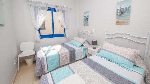 Krevet ili kreveti u jedinici u okviru objekta Mikonos Playa 15