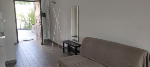 a living room with a couch and a table at Slowliday in Viverone