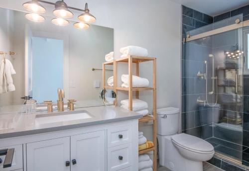 a bathroom with a sink and a toilet and a shower at 1536-A Deer Blvd in Avon