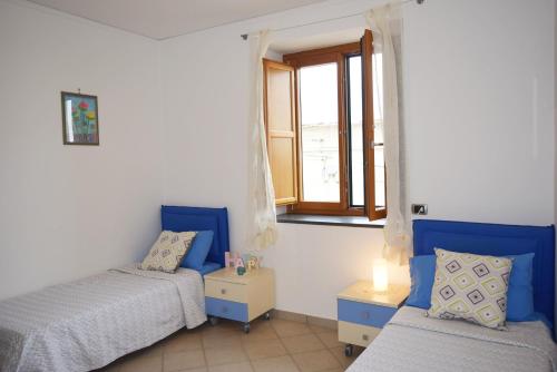 A bed or beds in a room at Casa Tonia