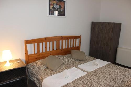 a bedroom with a bed with two towels on it at Studio Lavanda in Kornić, Krk in Kornić