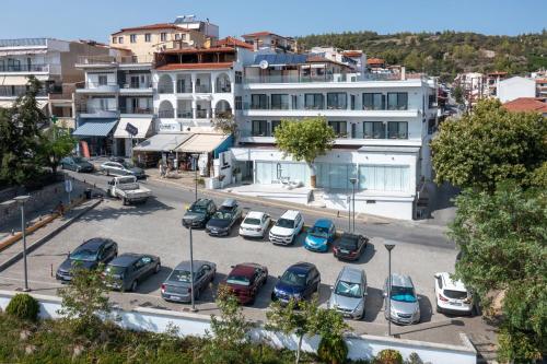 a group of cars parked in a parking lot at G Mare Boutique Hotel in Neos Marmaras