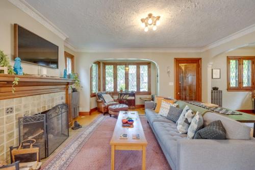 a living room with a couch and a fireplace at Ferndale Gem, Walk to Stores and Restaurants! in Ferndale
