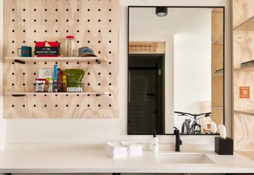 a bathroom with a sink and a mirror at Field Station Joshua Tree in Yucca Valley