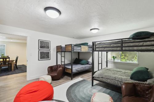 a bedroom with bunk beds and a living room at Family-Friendly Provo Vacation Rental Near BYU! in Provo