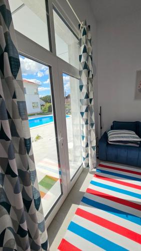 a living room with a large sliding glass door at Fantastic camp in Piteşti
