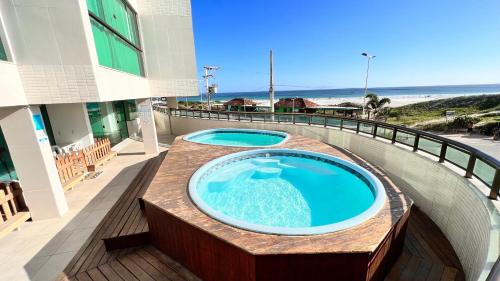 Πισίνα στο ή κοντά στο LOFT ORLA PRAIA GRANDE até 5 pessoas