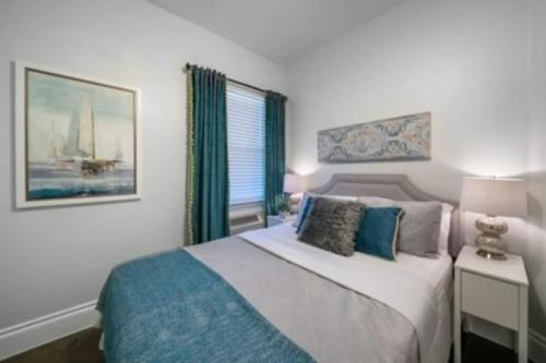 a bedroom with a large bed and a window at Brand New Lake Travis Estate - Awesome Pool in Austin