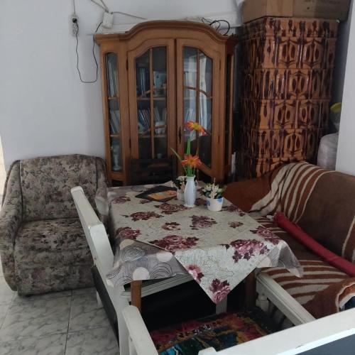 a living room with a table and a couch at Adriana in Murfatlar