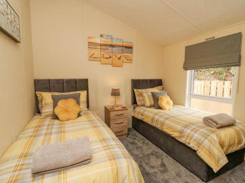 Postel nebo postele na pokoji v ubytování Platinum Lodge