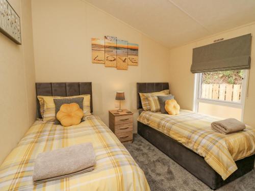 Ένα ή περισσότερα κρεβάτια σε δωμάτιο στο Platinum Lodge