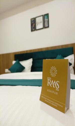 a box sitting on top of a bed at Hotel Raas Inn, New Hotel in Udaipur