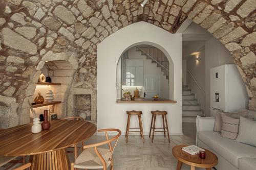 a living room with a couch and a table at Soleil boutique house with terrace in Rethymno Town
