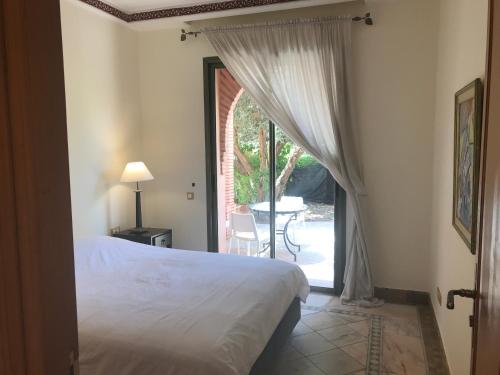 Voodi või voodid majutusasutuse Palmeraie Village 2 Relax and Pool toas