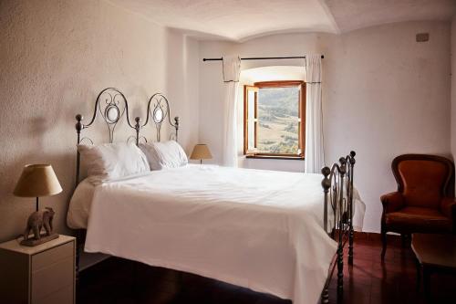 Ένα ή περισσότερα κρεβάτια σε δωμάτιο στο Il Torrione del Trebbia
