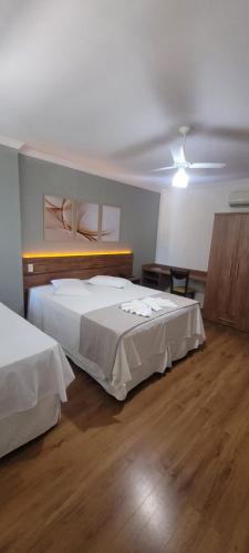 Postel nebo postele na pokoji v ubytování Hotel Águas Virtuosas