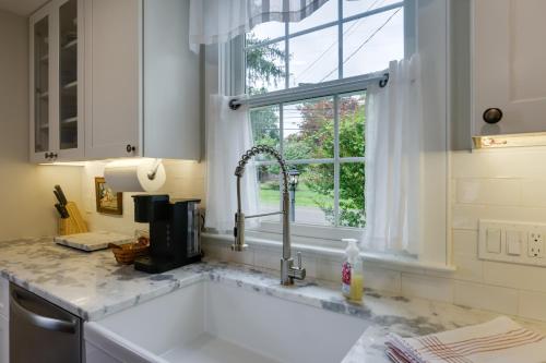 a kitchen with a sink and a window at Historic Erwinna Vacation Home Near Delaware River in Point Pleasant