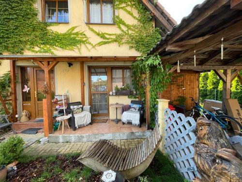 a porch of a house with a white fence at U Sovičky in Olešník