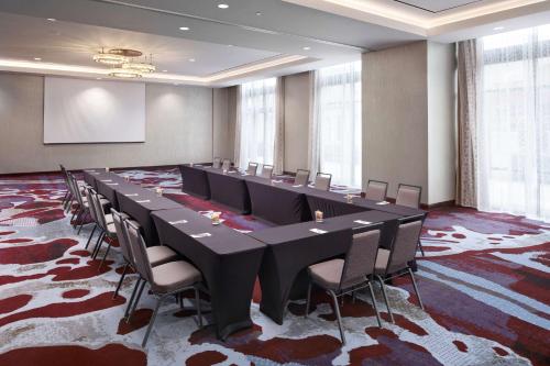 a large conference room with a long table and chairs at Embassy Suites Amarillo Downtown in Amarillo