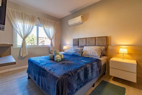 En eller flere senge i et værelse på Capri - Stay House Temporada