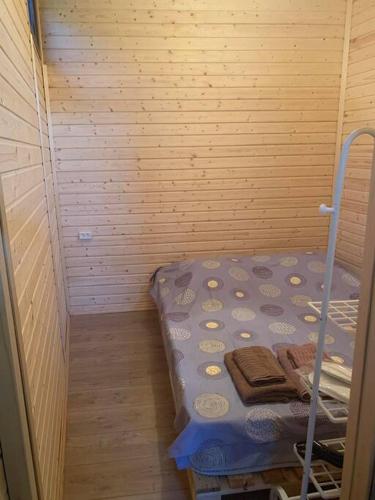 a small room with a small bed in a room at C`est la vie in Mtskheta