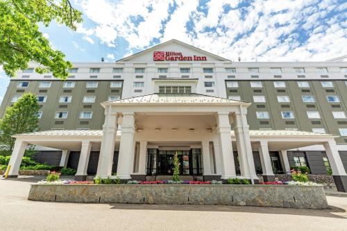 a rendering of the front of the hotel american inn at Hilton Garden Inn Boston Waltham in Waltham