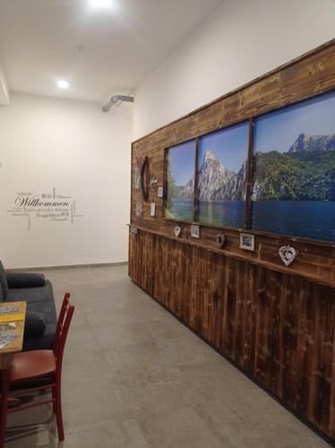 a living room with a large screen television in a wall at Rittertal-Altholzseeblick in Altmünster