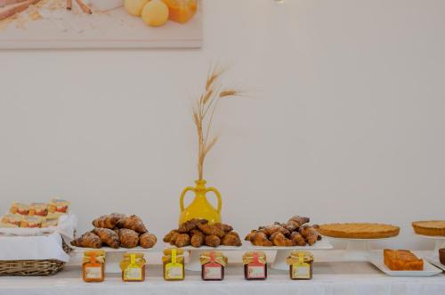 a table topped with lots of different types of food at Agriturismo Giorgio in Mattinata