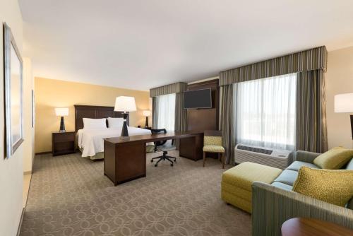 a hotel room with a bed and a desk at Hampton Inn & Suites Corpus Christi, TX in Corpus Christi