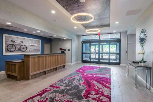 an office with a reception desk and a bike on the wall at Hampton Inn & Suites-Dallas/Richardson in Richardson