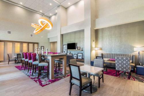 a dining room with a long table and chairs at Hampton Inn & Suites-Dallas/Richardson in Richardson