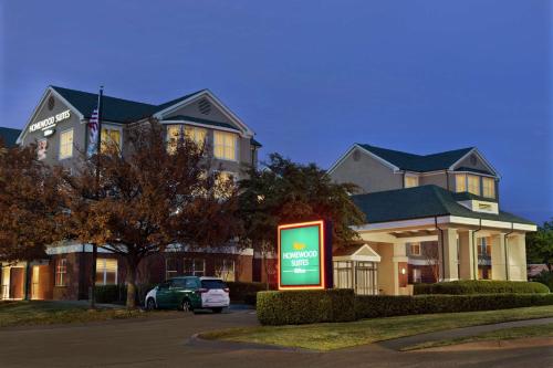 a house with a sign in front of it at Homewood Suites by Hilton Dallas-Plano in Plano