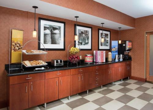 a buffet line in a restaurant with food on it at Hampton Inn Denver - Northwest Westminster in Westminster