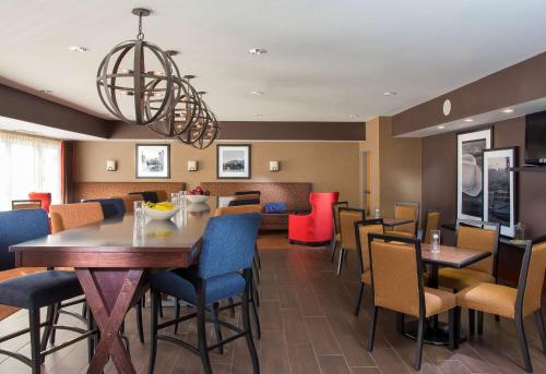 a dining room with a table and chairs at Hampton Inn Denver - Northwest Westminster in Westminster
