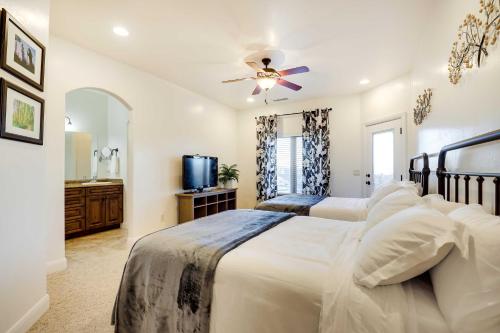 a bedroom with two beds and a ceiling fan at Horseshoe Bend Retreat with Fire Pit, Patio and Mtn Views in Page