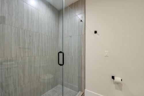 a shower with a glass door in a bathroom at Gorgeous Modern Mountain Home in Upward