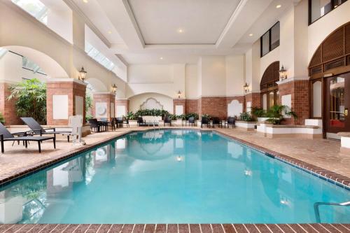 a pool in the lobby of a hotel at Embassy Suites Dallas - DFW International Airport South in Irving