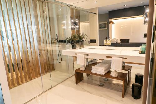 a bathroom with a shower and a sink and a mirror at Quinta de Silvalde in Santo Tirso
