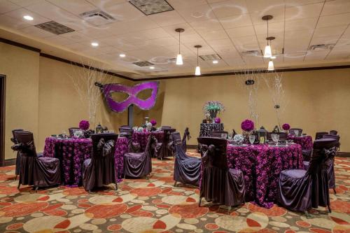 a banquet room with purple tables and purple decorations at Hilton Garden Inn El Paso University in El Paso