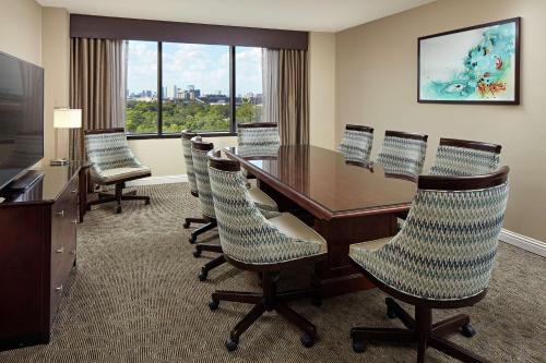 a conference room with a table and chairs at Hilton Houston Plaza/Medical Center in Houston