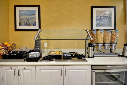 a kitchen with a stove and a counter top at Homewood Suites by Hilton Wilmington/Mayfaire, NC in Wilmington