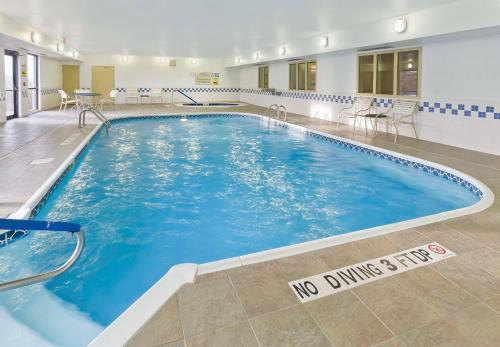 a large swimming pool with a no diving sign on the floor at Hampton Inn Lubbock in Lubbock