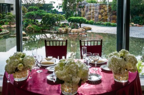 a table with a pink table cloth and flowers in vases at Doubletree by Hilton Los Angeles Downtown in Los Angeles