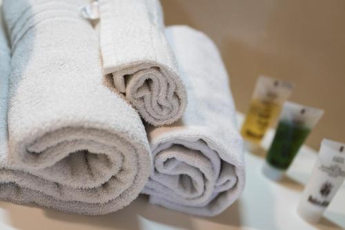 a pile of towels sitting on top of a sink at Ciasa Buro - Ron in Moena